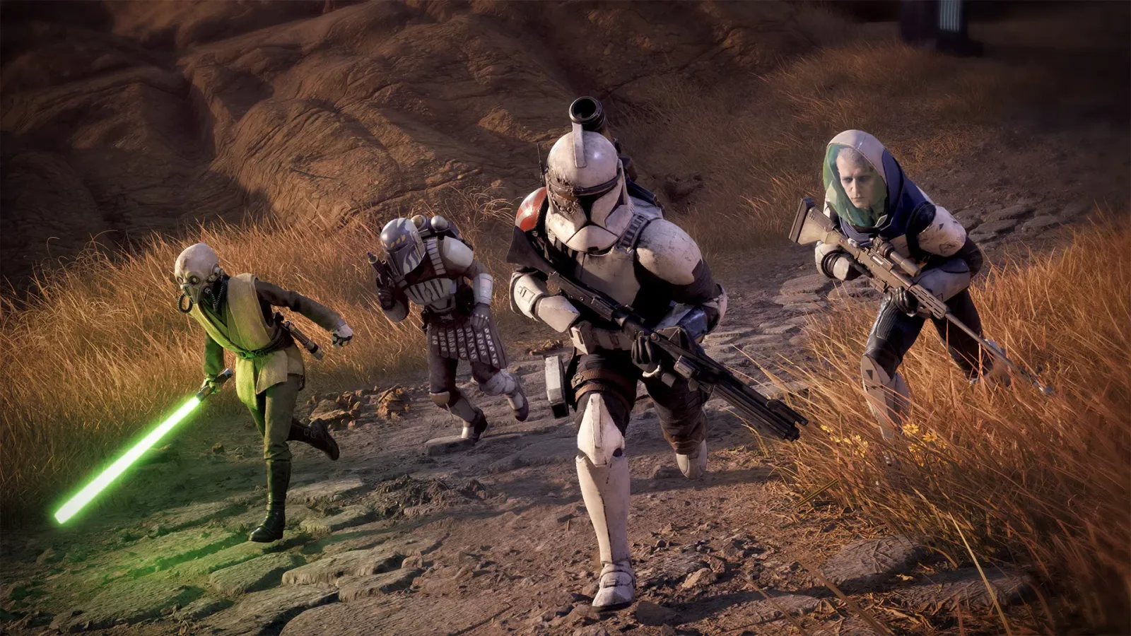 Source: www.ea.com Four operatives advance through a rocky, grass-covered landscape: a green lightsaber-wielding alien, a Mandalorian-style warrior, a battle-worn clone trooper, and a sniper.